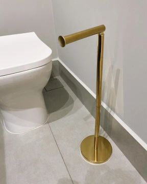 Porta papel higiênico de aço inox dourado