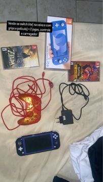 Nintendo switch lite( na caixa e com grips è película)