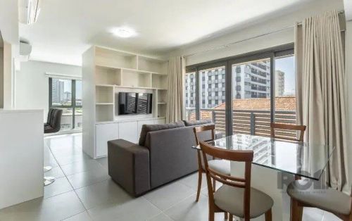 Apartamento mobiliado de 47 m², estilo Loft, 1 dormitório, 1 suíte, living com cozinha int