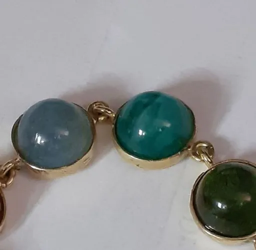 Pulseira em ouro amarelo com divisão de pedras coloridas brasileiras