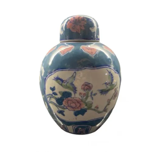 Vaso chinês em porcelana azul com cena de pássaros e floral.