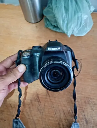 Camera fotográfica tá sem bateria  ela tou não sei tá bom ela 