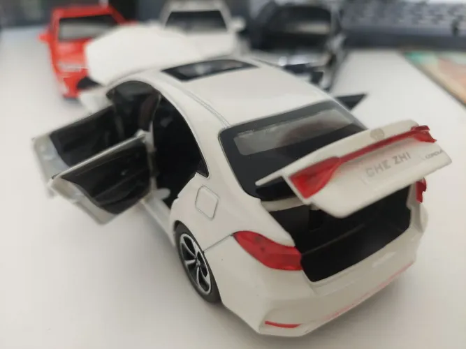 Muniatura Corolla bateria e fricção