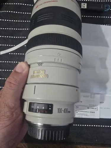 Vendo lente Canon 100-400 zerada toda revisada, gasto 1600 reais.