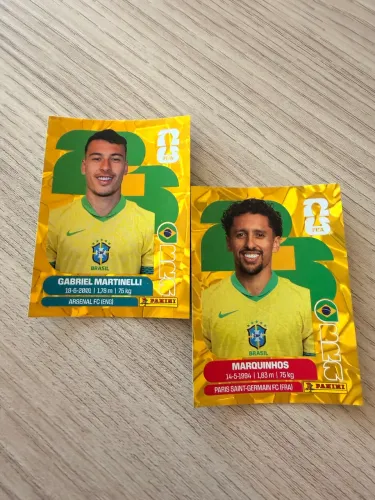 Marquinhos e Gabriel Martinelli Dourado Panini Copa do Mundo 2026