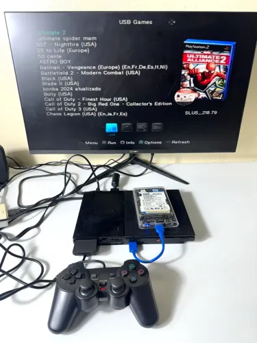 PlayStation 2 slim com jogos