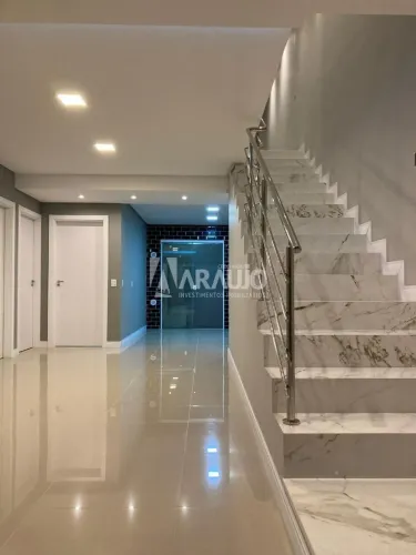Casa geminada com 1 suíte + 3 dormitórios à venda na Meia Praia em Navegantes