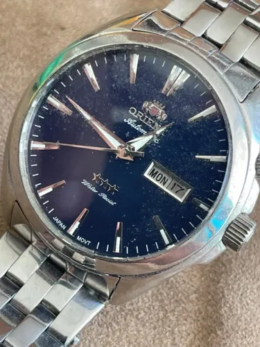 RELÓGIO ORIENT AUTOMATIC 03 ESTRELAS WATER RESIST 50M DAY DATE BLUE DIAL 44MM