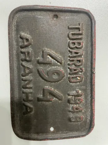 Placa de carros de boi e aranha