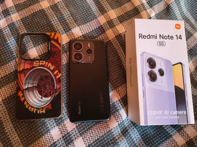 VENDO REDMI NOTE 14 5G 256GB, TEM NOTA FISCAL, TEM CAIXA ,02 CAPAS E A ORIGINAL DELE.