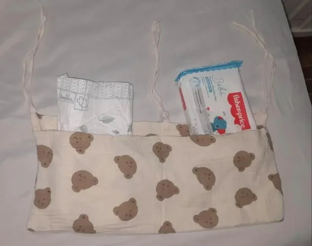 Porta fraldas para berço 