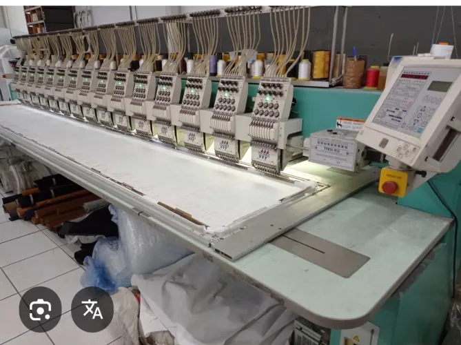 Operador de máquina de bordados Tajima