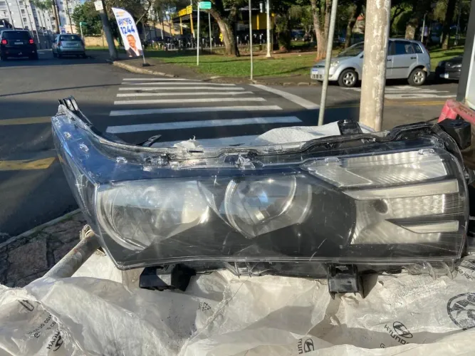 FAROL  COROLLA ORIGINAL DIREITO 