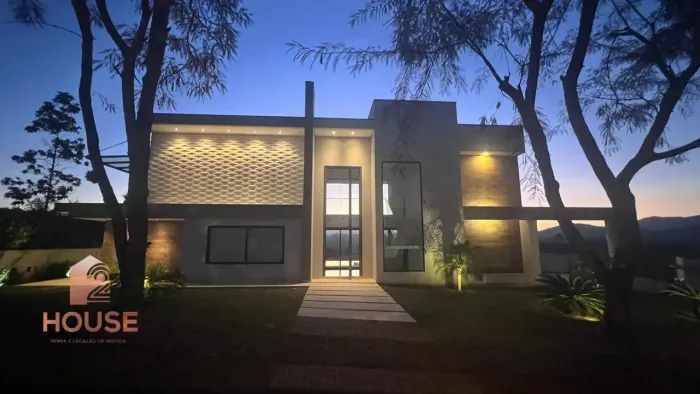 Casa com 4 dormitórios à venda, 474 m² por R$ 4.500.000,00 - Condomínio Reserva Ibirapitan