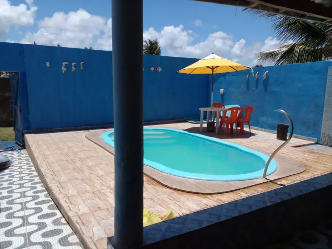 Alugo casa de frente ao mar!!!pe na areia