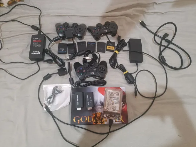 Vendo PS2 slim com 272 jogos no hd 