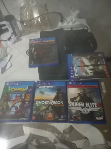 Vendo ps4 completo mas cinco jogos