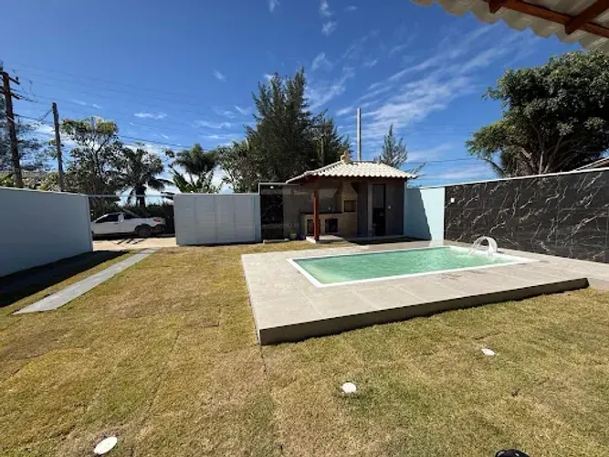 Casa com 3 dormitórios piscina , em condomínio à venda, 150 m² por R$ 360.000 - Unamar (Ta