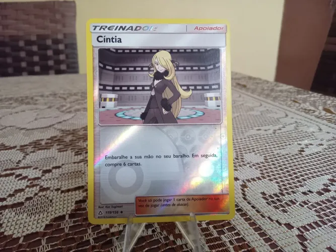 Carta tcg Pokémon treinador Cíntia reverse foil 119/156 estado SP