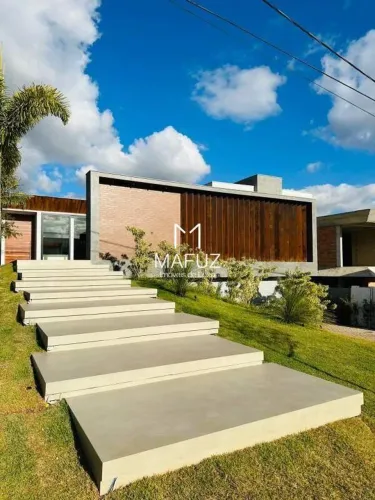 CASA Á VENDA COM 4 SUITES PROXIMO A PORTARIA E AREA GOURMET COMPLETA