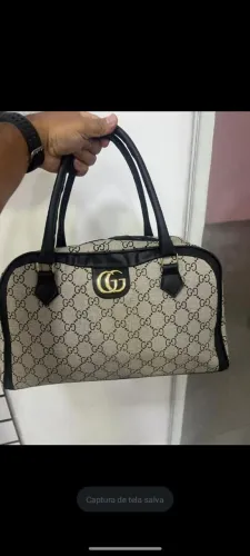Bolsa Baú da Gucci e Louis Vuiton