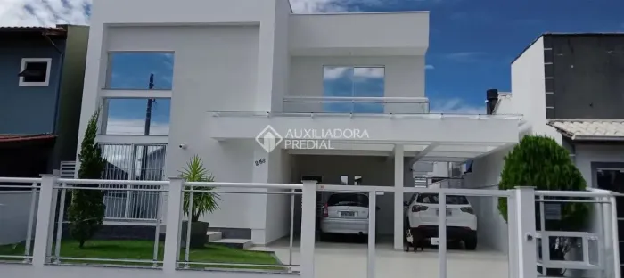 casa 4 dormitórios 321m2 privativos 4 vagas de garagem no bairro Carianos