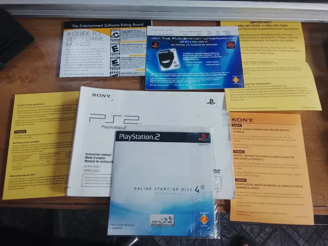 Manual e encartes originais do Playstation 2