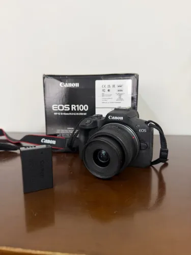 Câmera Cânon R100 + lente 18-45 (kit completo)