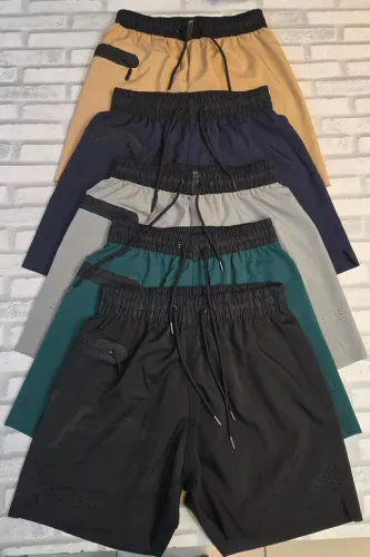 short elastano com zipper no bolso liso