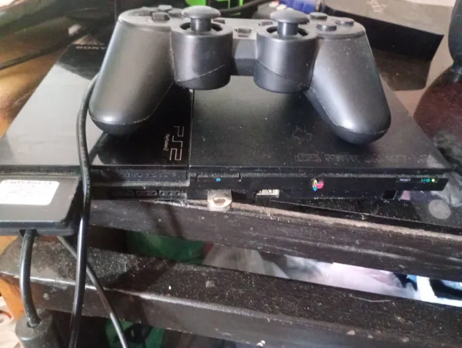 PLAYSTATION 2 C/1 CONTROLES E 60 JOGOS + 0LP<br>R$ 598,00<br>Shopee