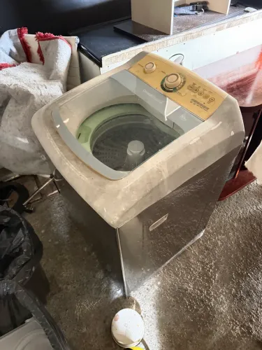 Máquina de lavar com defeito 