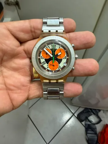 Relógio Swatch prata cara laranja medio 