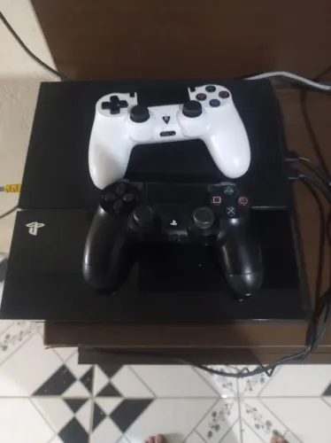 Vende se ps4 com volante 2 controles e 3 jogos