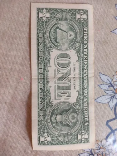 One dollar IN GOD WE TRUST