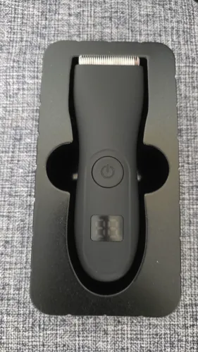 Máquina de aparar e raspar pelos.