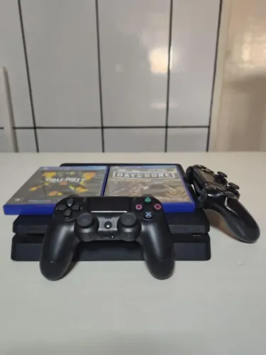 Vendo PS4 slim 500 GB com dois controles e com 27 jogos digitais