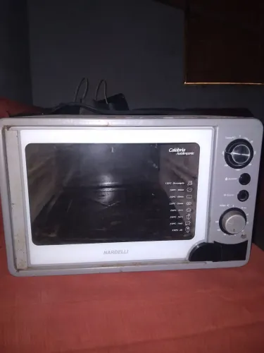 Troco forno funcionando em uma máquina de lavar