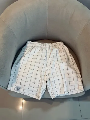 Shorts bermudas e chuteira umbro