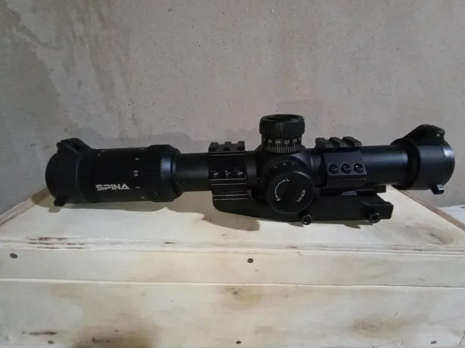 Vendo luneta Short Dot Spina 1.2x6x24mm SFP, com retículo luminoso verde e vermelho.