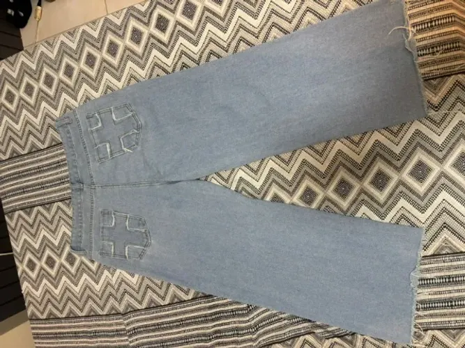Calça jeans com cruz tamanho M