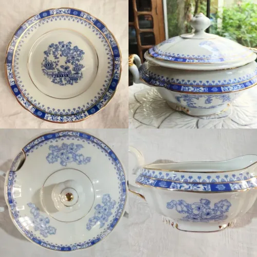 Jogo de jantar completo Real, tons de azul , branco e detalhes em dourado.