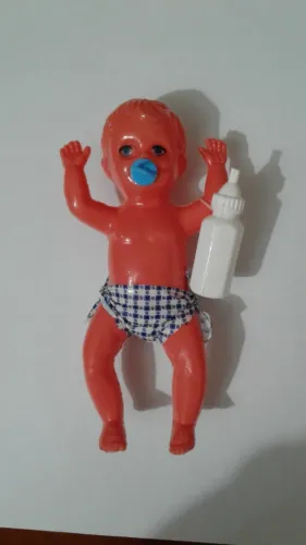 Boneco antigo Parapedro com chupeta e mamadeira