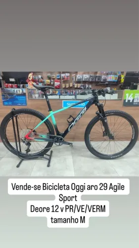 BICICLETA OGGI ARO 29 AGILE SPORT DEORE 12V PR/VE/VERM TAM M