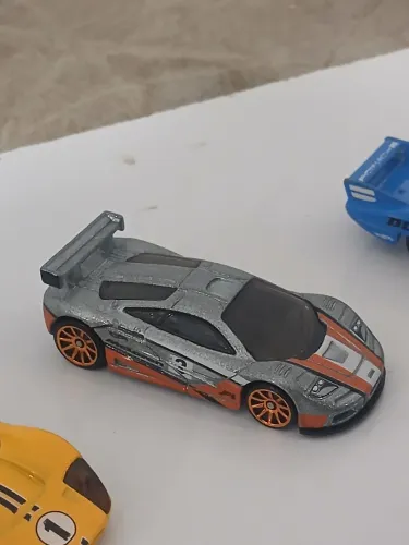 Lote com 7 hotwheels mc laren f1 porsche 917 bmw ford gt mk3 vw sirocco porsche gt3 e spyd