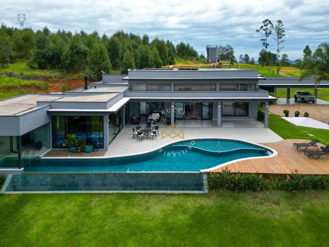Casa com 5 dormitórios à venda, 703 m² por R$ 5.999.000,00 - Condomínio Fazenda Iracema - 
