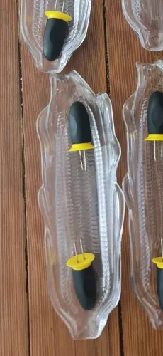 Quatro suporte para milho cozido