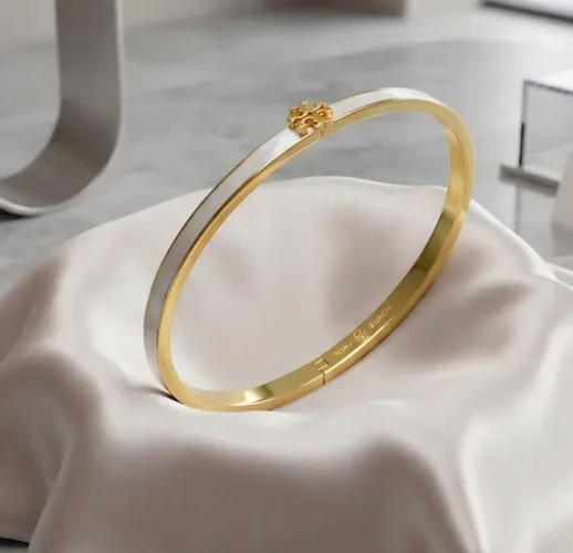 Bracelete Tory Burch Dourado e branco