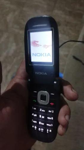 Nokia 2660 com caixa carregador e fone