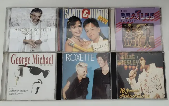 Lote c/ 5 CDs diversos Sandy e Junior Andrea Bocelli Beatles Elvis Presley George Michael