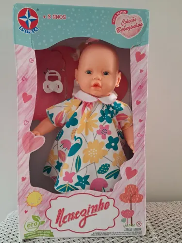 Boneca nenezinho da estrela. Ela acompanha só a chupeta .